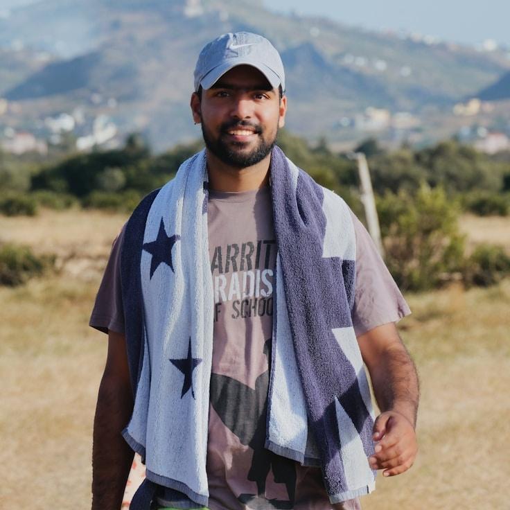 Kaveri Mehta, Lead Design Curator at GoldenSunrisePath, evaluating corporate floral arrangements